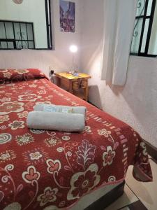 Ένα ή περισσότερα κρεβάτια σε δωμάτιο στο Hotel Suites Taxco