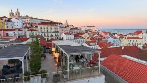 a view of a city with red roofs and buildings at Asian Everest House in Lisbon