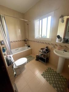 a bathroom with a toilet and a tub and a sink at Luxury Pool Villa in Arenas - Andalusia in Los Valverde