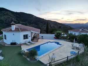 an aerial view of a house with a swimming pool at Luxury Pool Villa in Arenas - Andalusia in Los Valverde