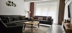 Posezení v ubytování Value Living Apartment