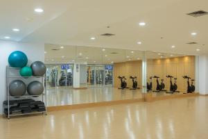 a gym with a row of exercise bikes in a room at K Suites in Quito