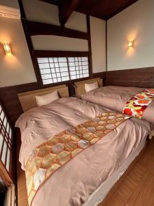 a bedroom with two beds in a room at IZU Elysian View in Koura