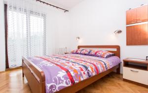 Ein Bett oder Betten in einem Zimmer der Unterkunft Apartments Lucija