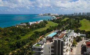 an aerial view of a resort near the ocean at Beautiful sea view apartment in the Hotel Zone Cancun in Cancún