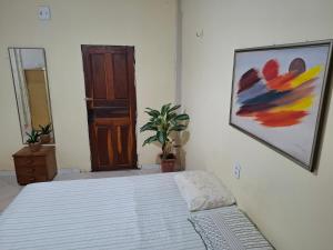 Postel nebo postele na pokoji v ubytování Suíte Cama Queen perto Centro Histórico e Praias