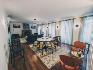 a living room with a table and chairs at Aurora Hostel in Angra do Heroísmo