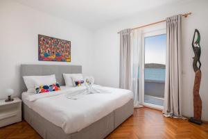 Postel nebo postele na pokoji v ubytování Villa Nensi + 37 fotografií