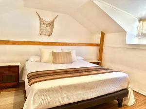 Rúm í herbergi á Hostal RustiKo Experiencias