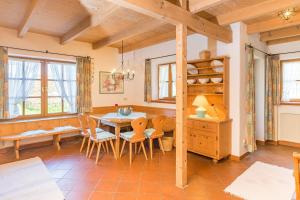 a dining room with a table and chairs at Ferienhaus Alp Chalet in Kochel