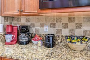 a kitchen counter top with a coffee maker and a mixer at Luxury 4-BR-BBQ-waterview-screened lanai-wood floors 211 in Saint Augustine