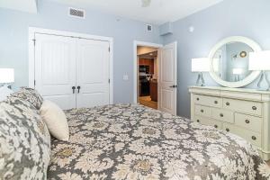 a bedroom with a bed and a dresser and a mirror at 4108-1P Relax in this 1 BR Peaceful Haven in Saint Augustine +28 photos