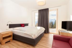 Postel nebo postele na pokoji v ubytování Schmiedhof Alm