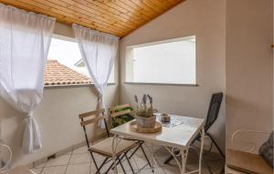 a small dining room with a table and chairs at Cozy Home In Selce With Wifi in Selce