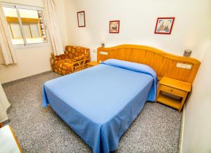 Voodi või voodid majutusasutuse Hostal Los Corchos toas