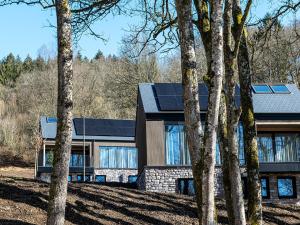 a house with solar panels on top of it at Villa in Belgium with Private Terrace in La Roche-en-Ardenne +9 photos