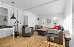 a living room with a couch and a table at 3 Bedroom Beautiful Home In Gilleleje in Gilleleje