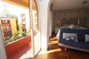 a bedroom with a bed and a balcony at Brand new apartment 4 blocks from Plaza Armas Arequipa in Arequipa