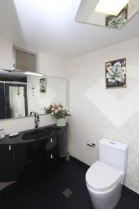 a bathroom with a white toilet and a sink at Brand new apartment 4 blocks from Plaza Armas Arequipa in Arequipa