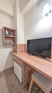TV a/nebo společenská místnost v ubytování Foung Gu Hotel