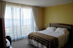 Postel nebo postele na pokoji v ubytování Hotel Patagonia Insular