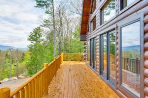 a porch of a home with a view of the mountains at Mtn-View Deck Scenic Conway Log Cabin! in Conway
