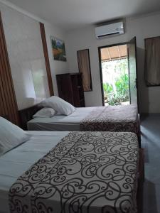Postel nebo postele na pokoji v ubytování BB Homestay Two