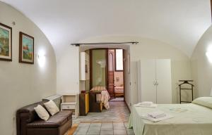 a bedroom with a bed and a couch in a room at Villa Santa Sofia in Vico Equense