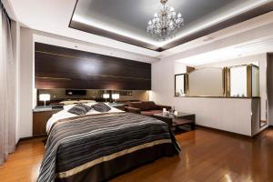 Letto o letti in una camera di Hotel MYTH-L&A-ホテル マイス エルアンドエー -adult only-