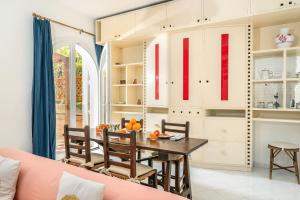 a kitchen and dining room with a table and chairs at Villa Sofia in Massa Lubrense