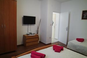 Postel nebo postele na pokoji v ubytování Apartments Jadranka