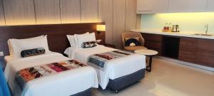 Signata Genting Highlands客房内的一张或多张床位