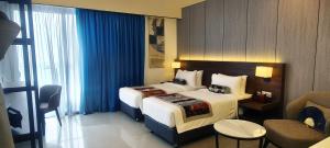 Signata Genting Highlands客房内的一张或多张床位