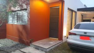 a car parked in front of a house at Dpto San Javier in Yerba Buena