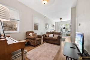 a living room with a piano and a couch at Prime Location Retreat 4 Bedrooms w Parking in Chicago