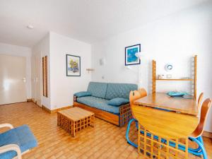 a living room with a couch and a table at Studio vue mer avec Wi-Fi pour 4, Roquebrune-Cap-Martin - FR-1-827-92 in Roquebrune-Cap-Martin