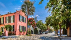 a street in a town with a palm tree and buildings at Holiday Inn Santee by IHG in Santee