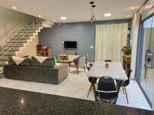 a living room with a couch and a table at Casa Ampla COP30 in Belém
