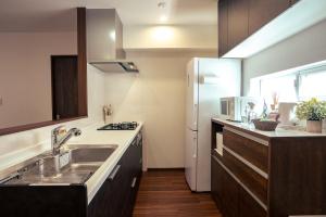 Η κουζίνα ή μικρή κουζίνα στο 無料レンタカー付 Value Residence Hotel 腰原
