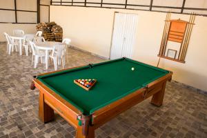 a pool table in a room with a ball on it at Resort Maldo in Ayacucho