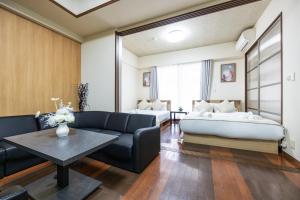 Llit o llits en una habitació de Master Residence Dotonbori Shinsaibashi 37 fotos més