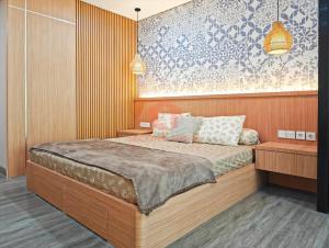 Lavaya Resort 1BR Nusa Dua with Pool, WiFi, Netflix by 2ndHome客房内的一张或多张床位