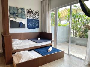 Postel nebo postele na pokoji v ubytování JOMSTAY Octagon Ipoh Suites