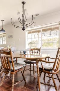 a dining room with a wooden table and chairs at Willow Nest - Sequoia And Kings Canyon Retreat - Comfort In Nature in Hoffman Point