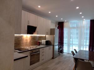 Kuchyň nebo kuchyňský kout v ubytování AVALON Apart-Hotel