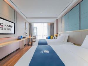 Ένα ή περισσότερα κρεβάτια σε δωμάτιο στο Echarm Hotel Huangshi Yingbin Avenue +113 φωτογραφίες