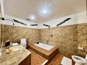 Ένα μπάνιο στο Tiga Naga Villa