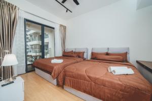 a bedroom with two beds and a balcony at Danga Bay Coastal Comfort 3BR 8Pax w 3Balcony by Our Stay in Johor Bahru +48 photos