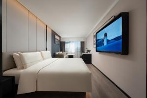 Sjónvarps- og/eða afþreyingartæki á Atour Hotel Beijing Zhongguancun Software Park West Shangdi Road