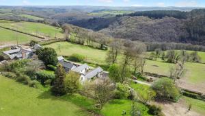 an aerial view of a house in a field at Sheepfold Cottage Dulverton in Dulverton